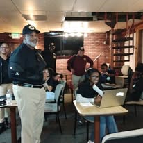 Mentors and students in session